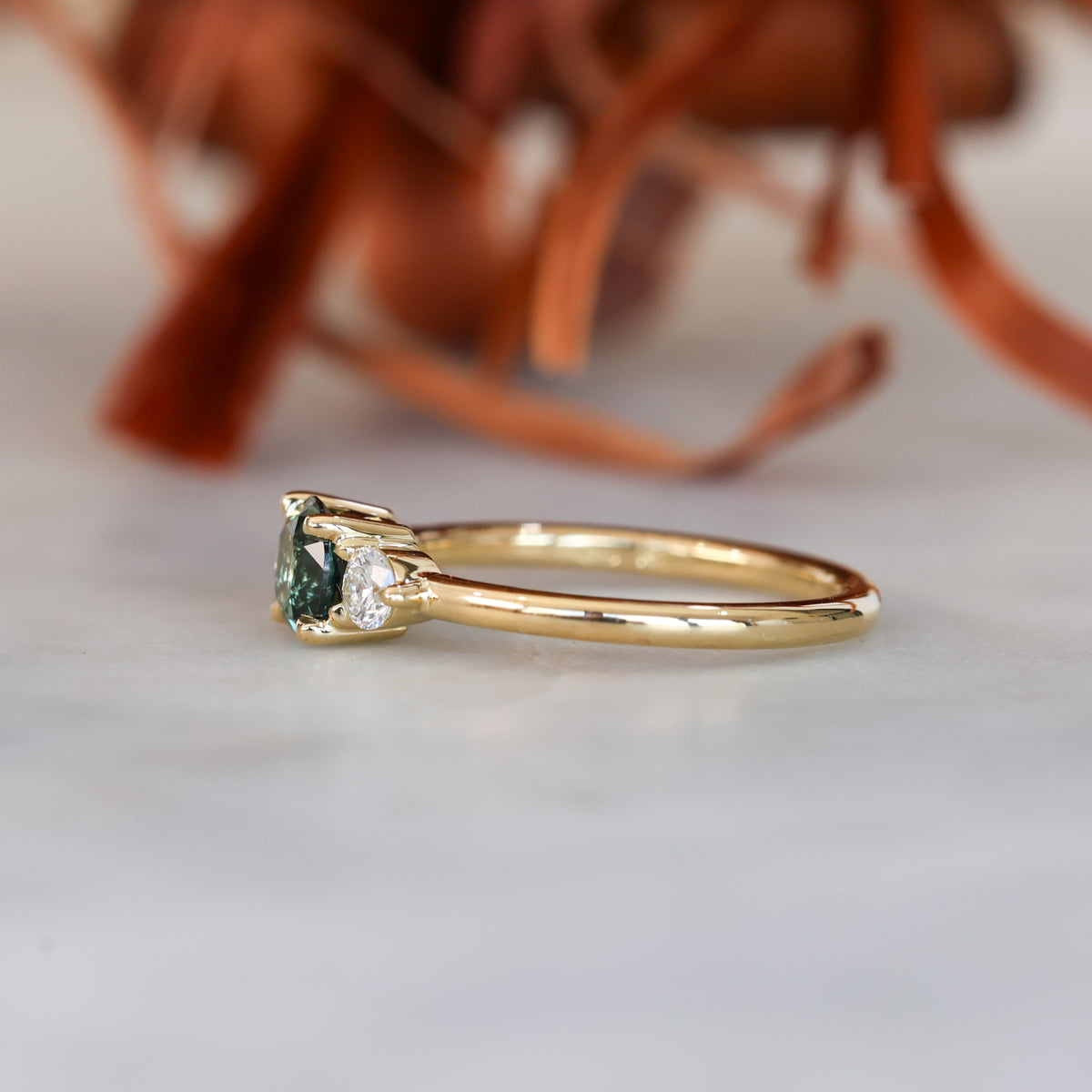 0.68ct round cut natural australian sapphire and diamond trilogy engagement ring in yellow gold