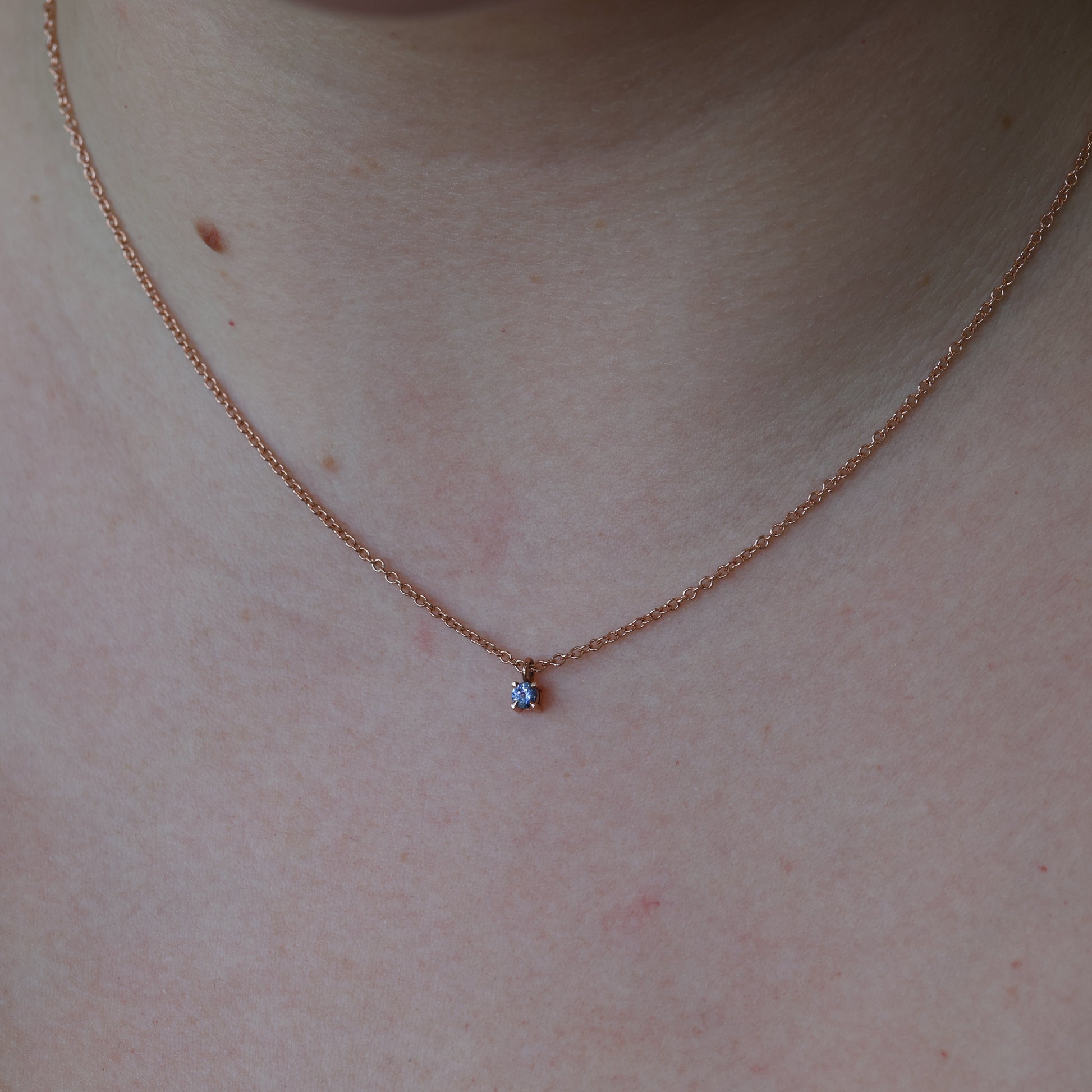 petite montana sapphire necklace on neck