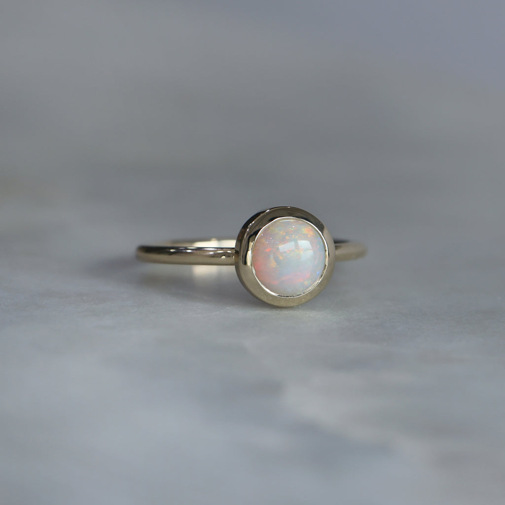 round cut bezel set Australian opal ring