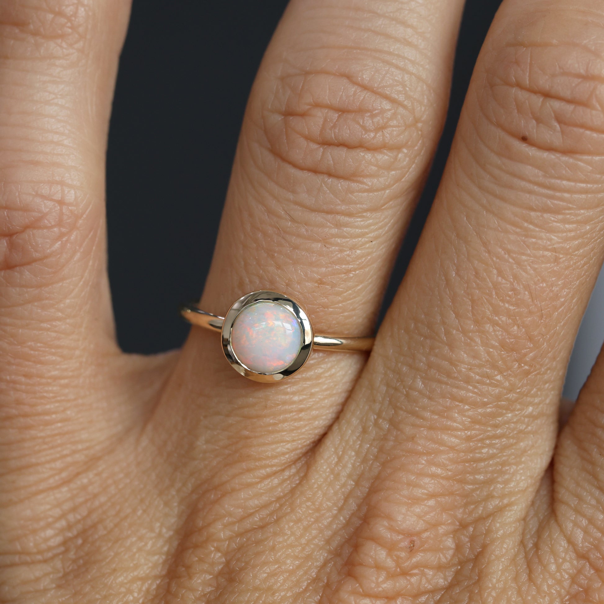 round cut bezel set Australian opal ring