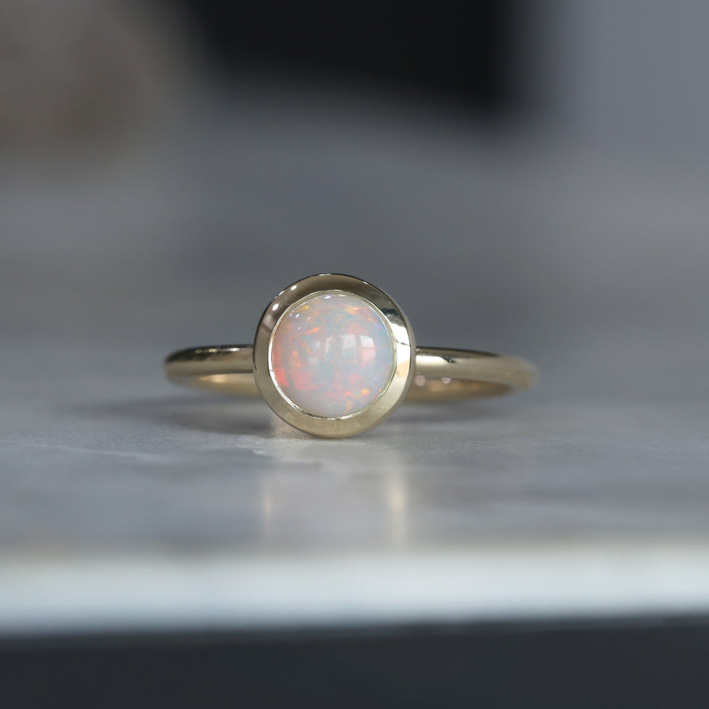 round cut bezel set opal ring