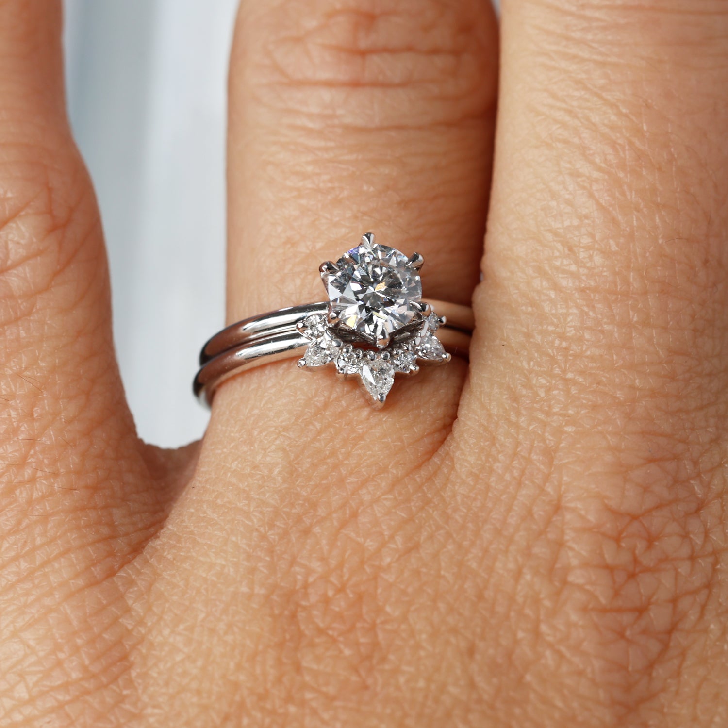 tegan diamond arch wedding band on hand with engagement ring