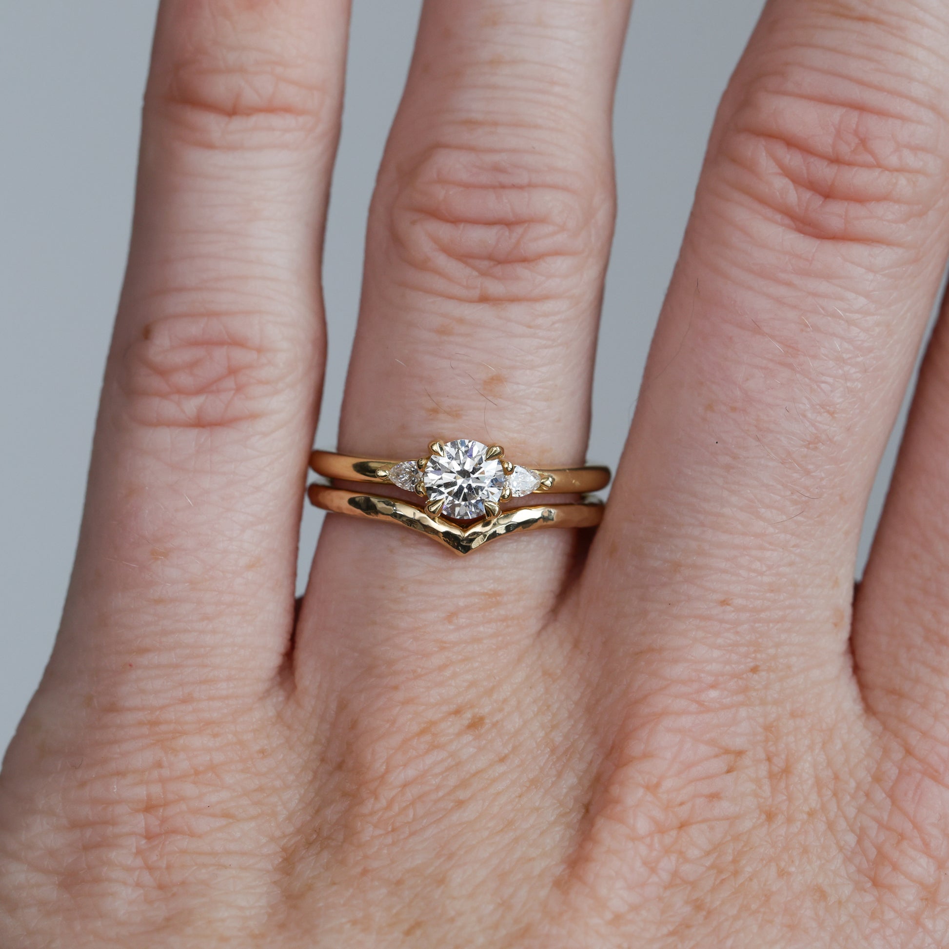 textured billy wedding band on hand