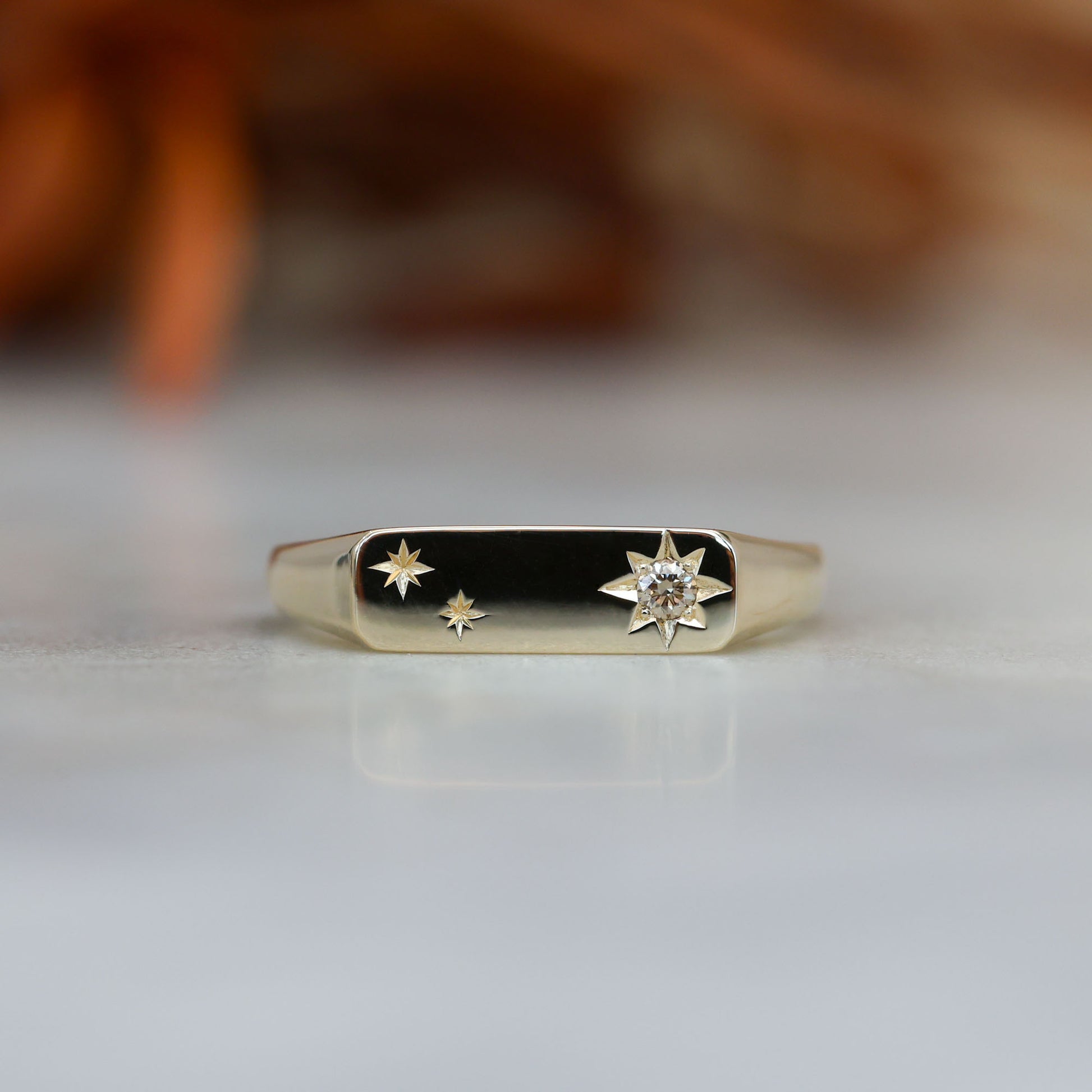 two star and champagne diamond bar signet ring