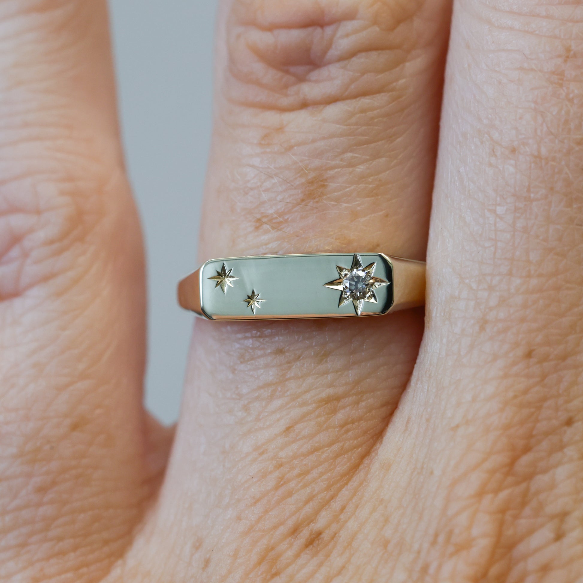 two star and champagne diamond bar signet ring