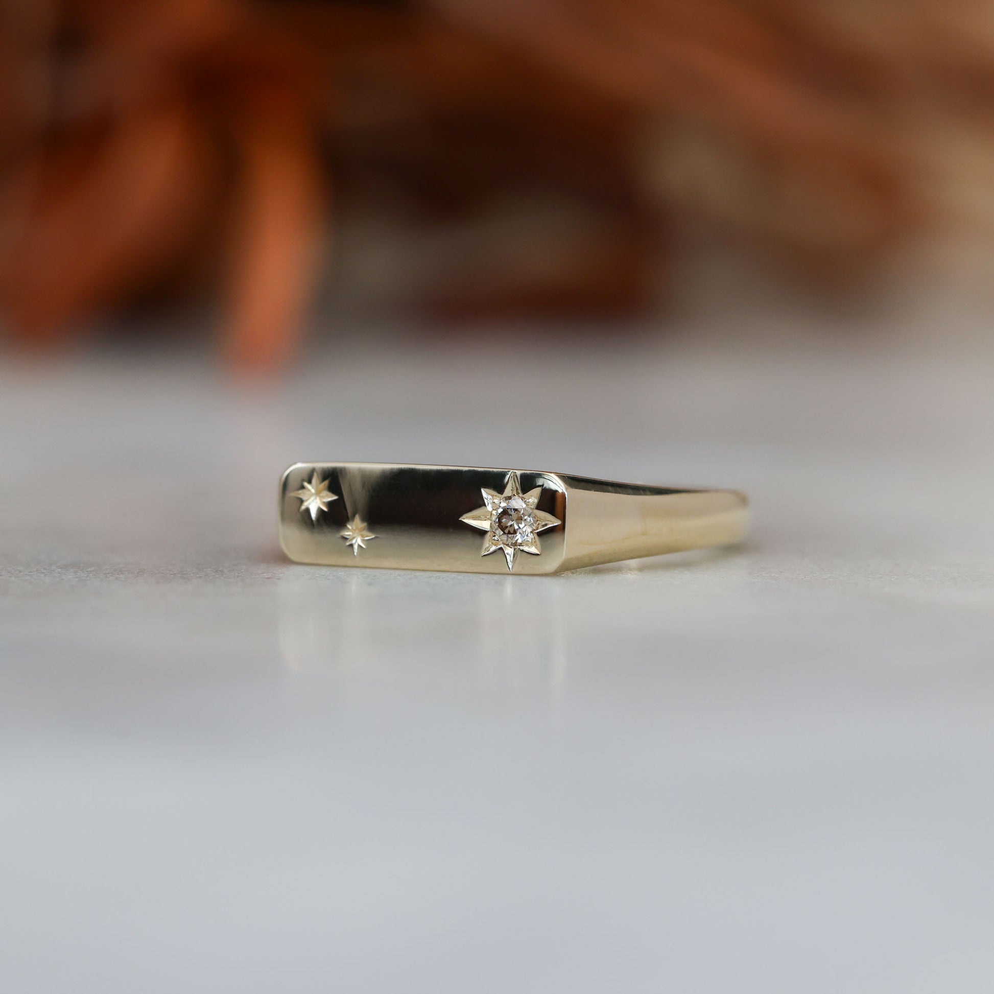 two star and champagne diamond bar signet ring 
