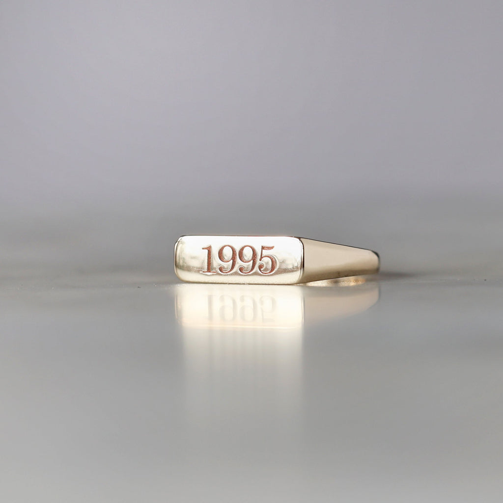 year bar signet ring side yellow gold