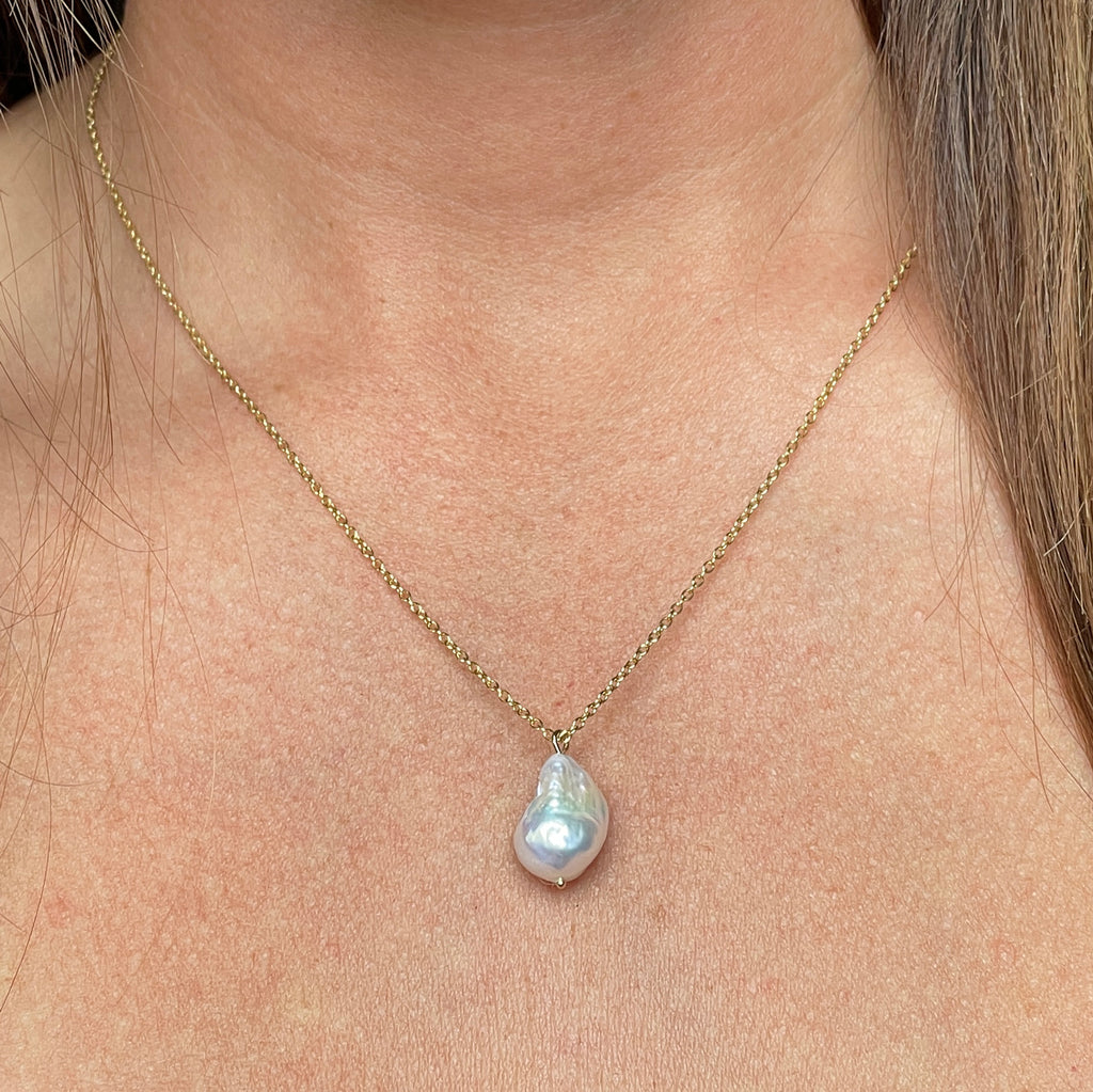Drop pearl necklace on neck