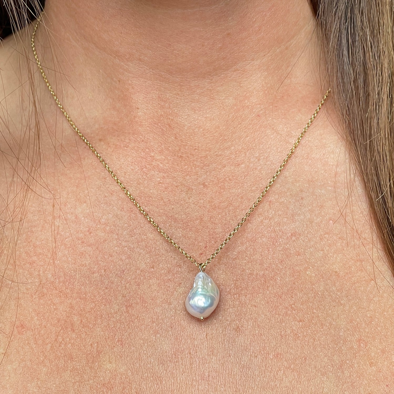 Drop pearl necklace on neck