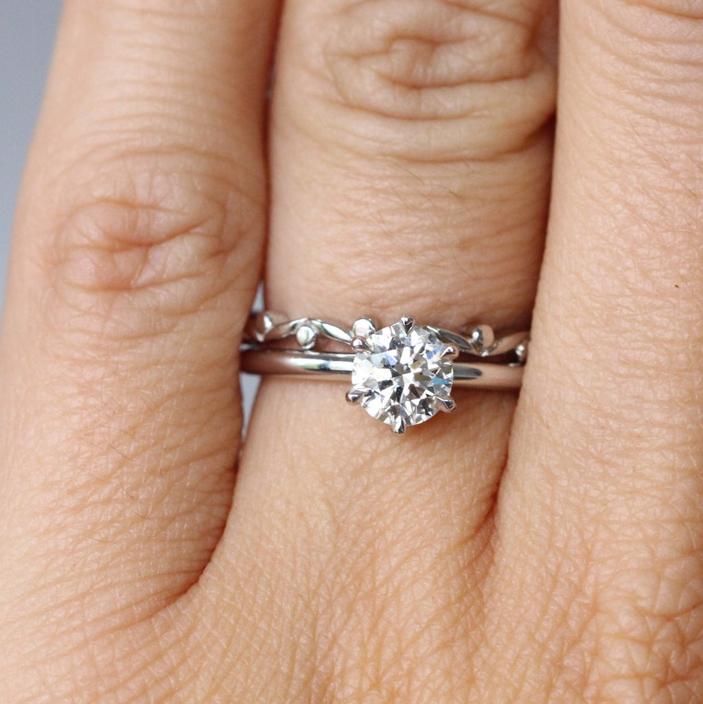 nature inspired gum leaf wedding band on hand