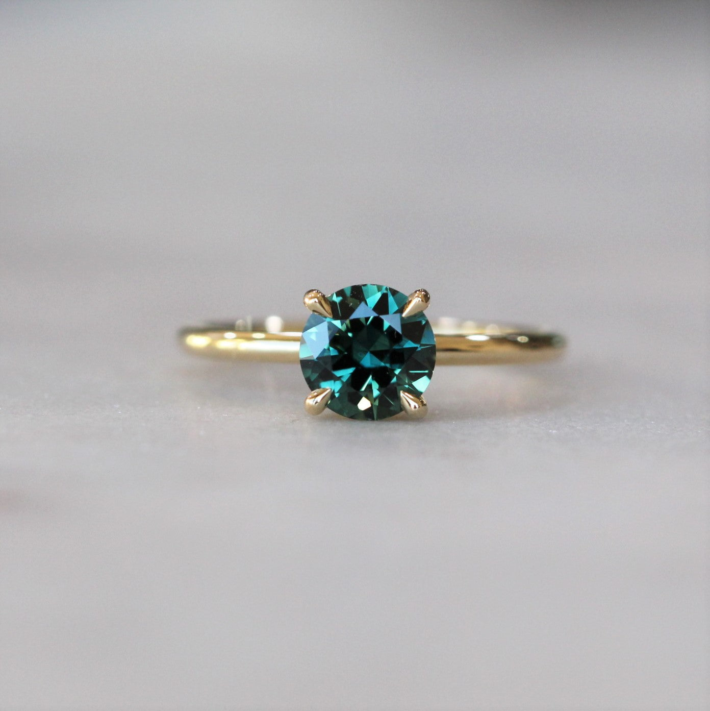 ROUND / TEAL AUSTRALIAN PARTI SAPPHIRE RING