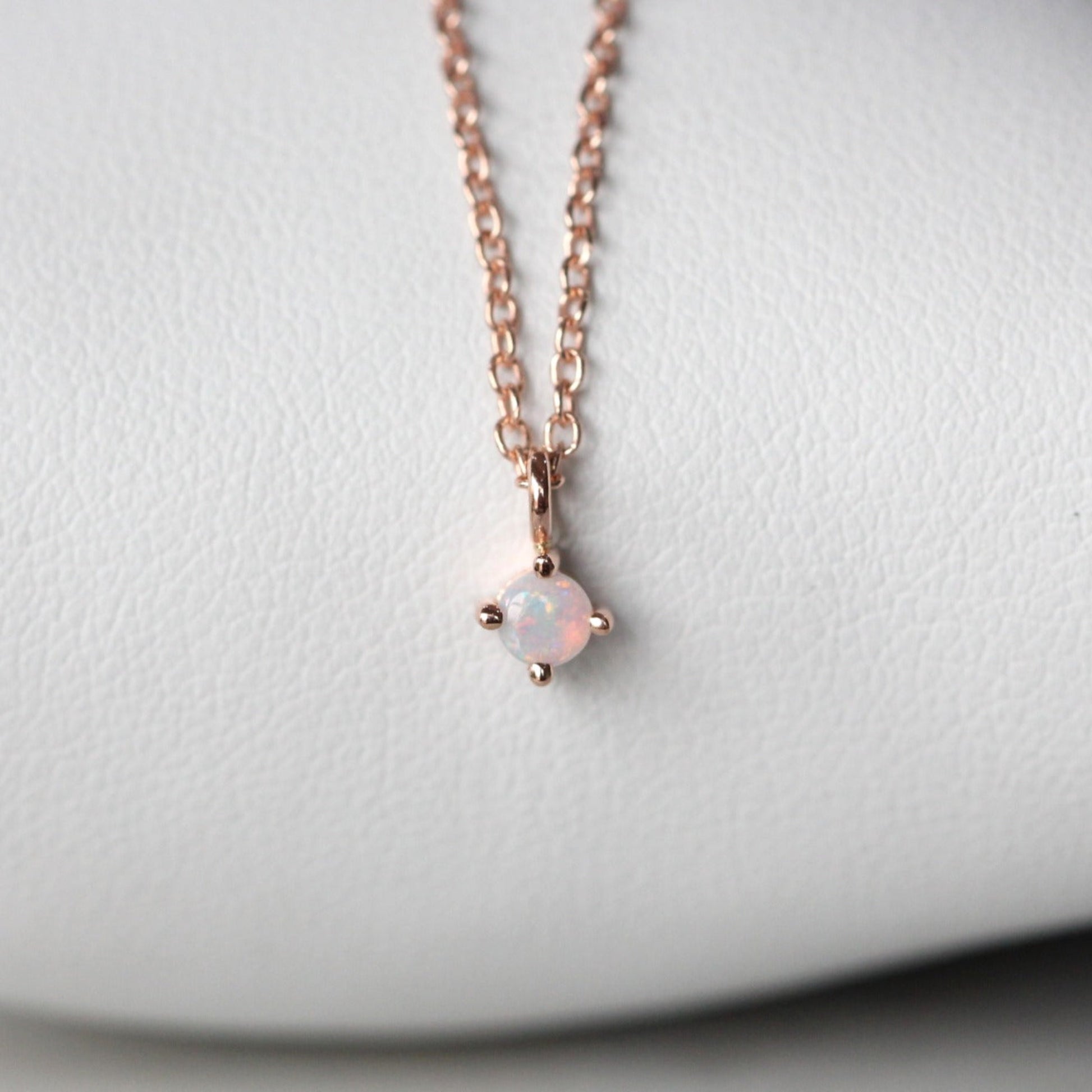 Petite opal necklace star set rose gold