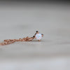 Petite opal necklace star set rose gold front view