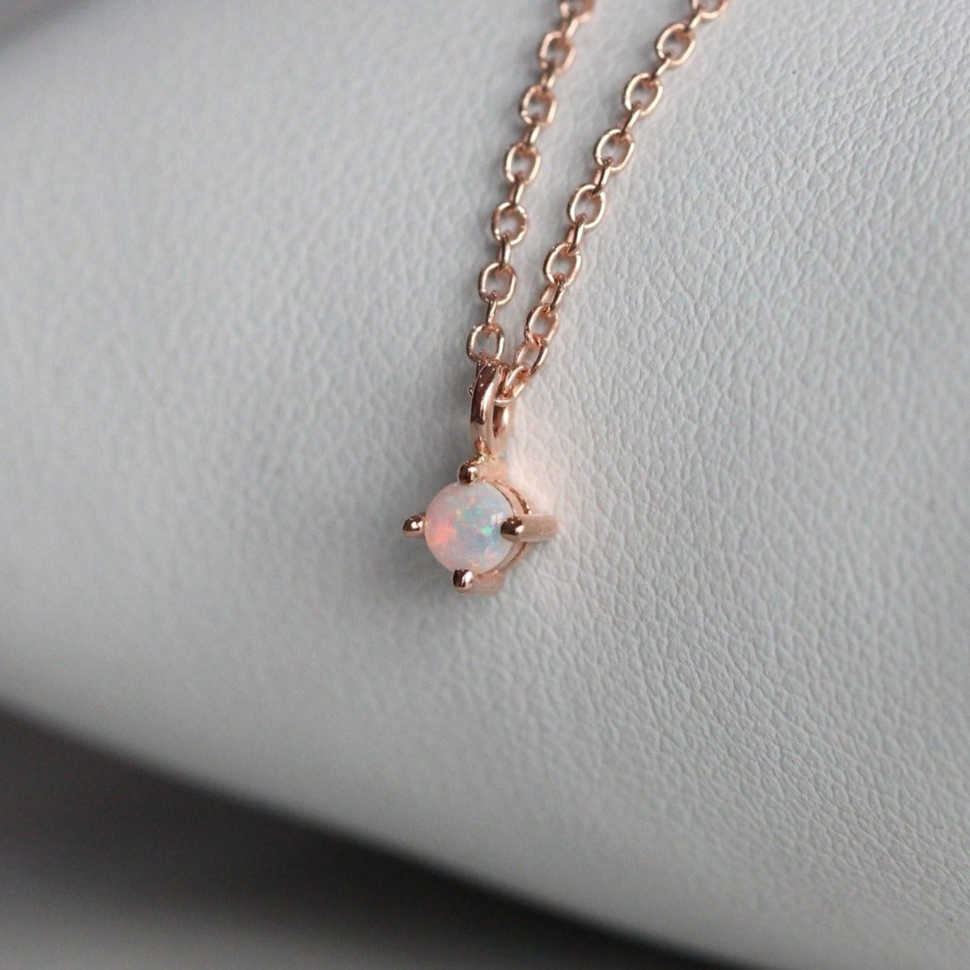 Petite opal necklace star set rose gold side view